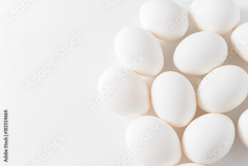 White eggs on a white background. Easter photo concept. Copy space. View from above.