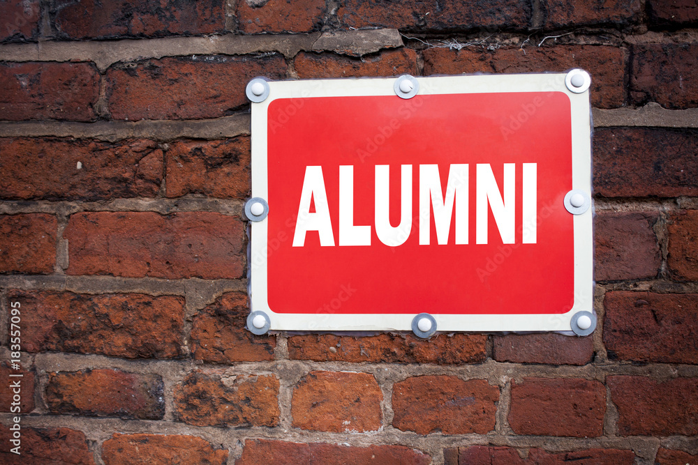 Hand writing text caption inspiration showing Alumni Former Students concept meaning Celebration Education Ending written on old announcement road sign with background and copy space
