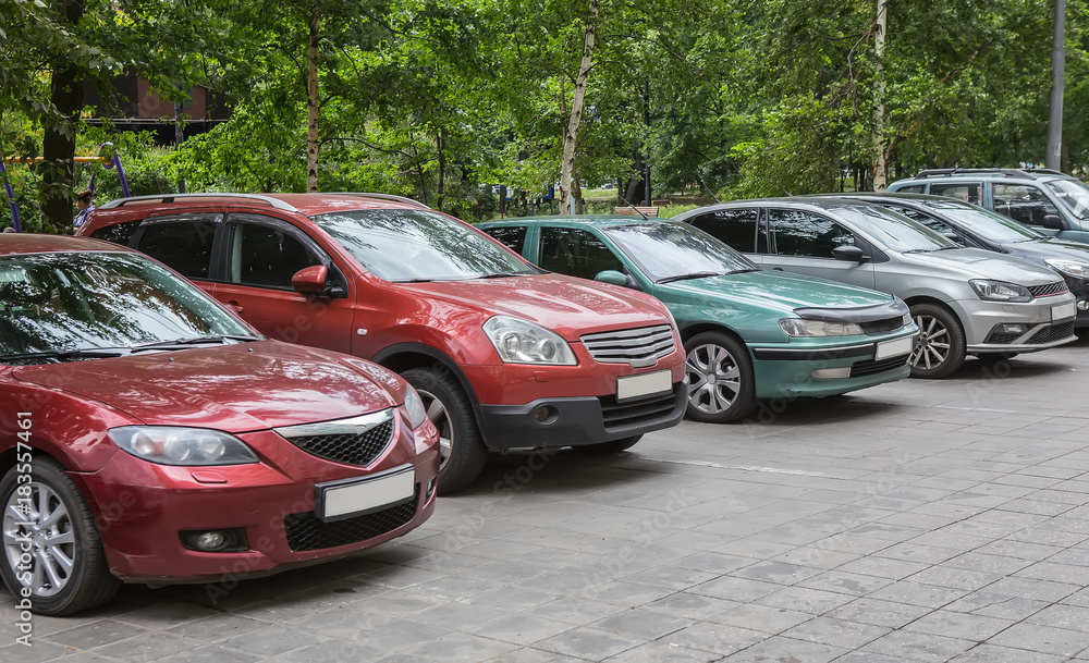 cars parked in a row. cars parked in a row.