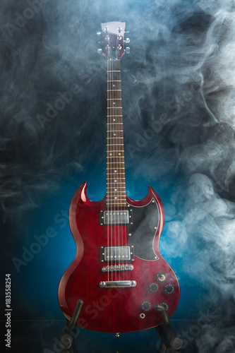 electric guitar in smoke, blue background