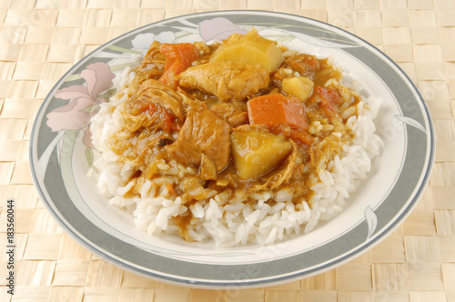 Chicken curry over steamed white rice.