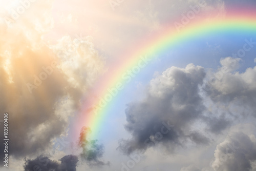 Obraz na płótnie Blue sky floor with rainbow and sun reflection , Beautiful sky after rain