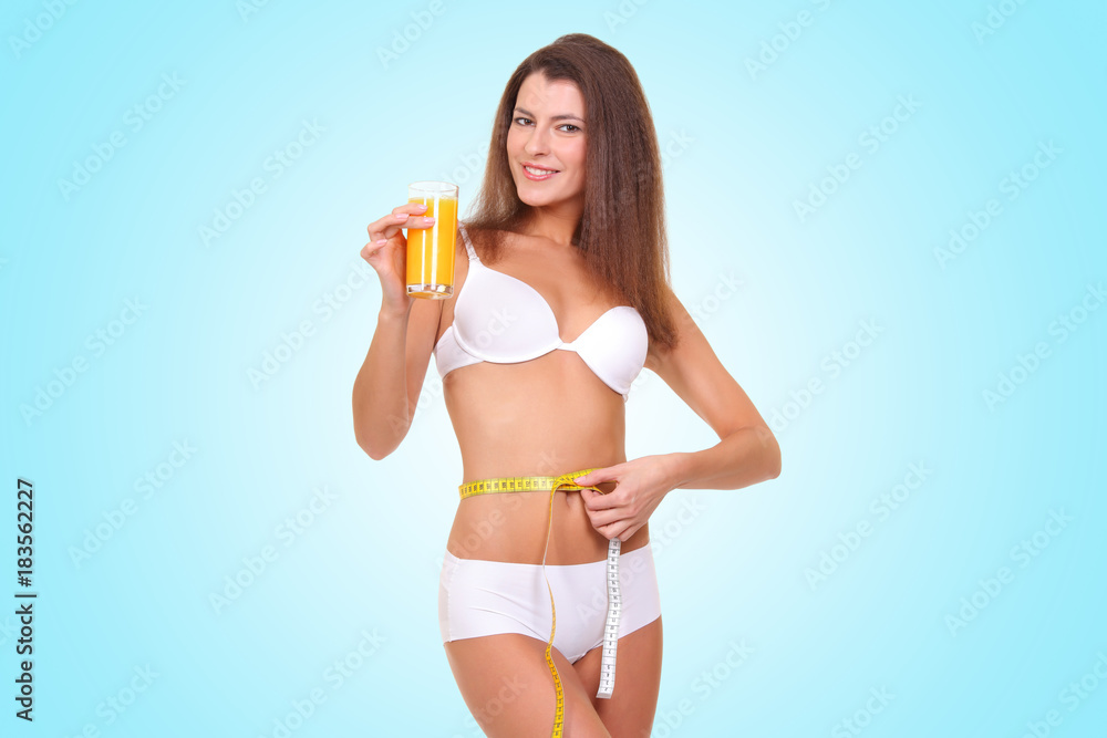 Naklejka premium girl in white underwear measures her waist