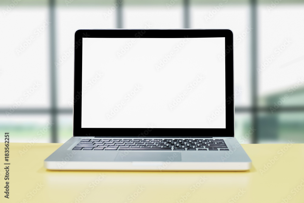 Computer with white screen on table with blur background. Technology concept. Computer with white screen on table with blur background. Technology concept.