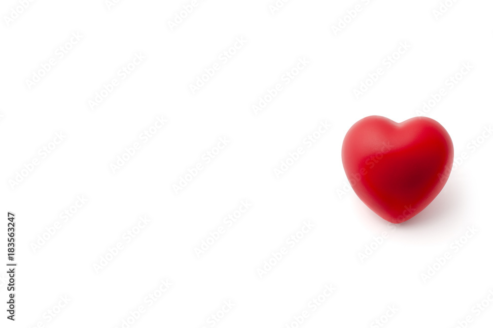 Red Rubber Heart on White Background with Copy Space