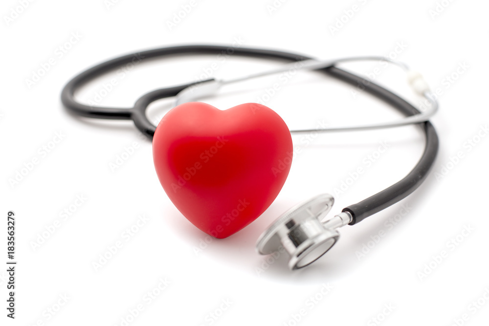 Red Rubber Heart with Stethoscope in the Background Red Rubber Heart with Stethoscope in the Background