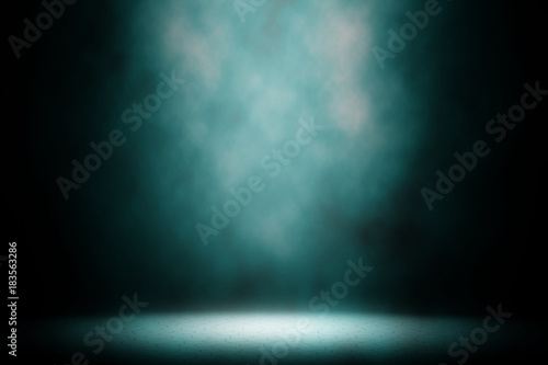 Light blue spotlight smoke stage background.