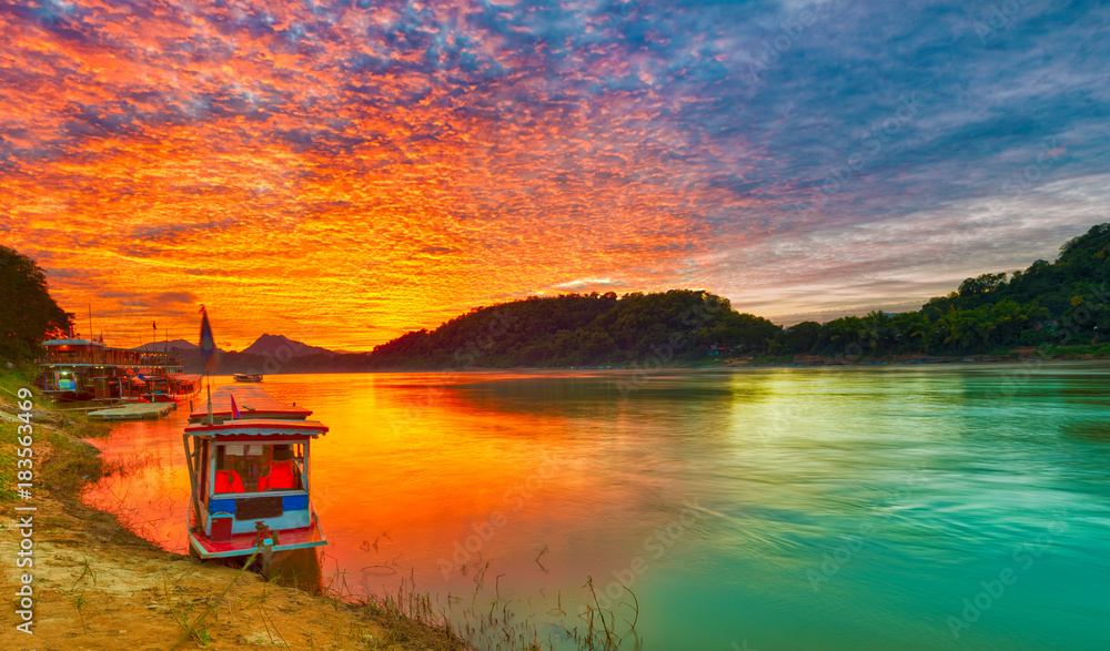 Touristic boat at sunset. Beautiful landscape. Luang Prabang. Laos. - obrazy, fototapety, plakaty 