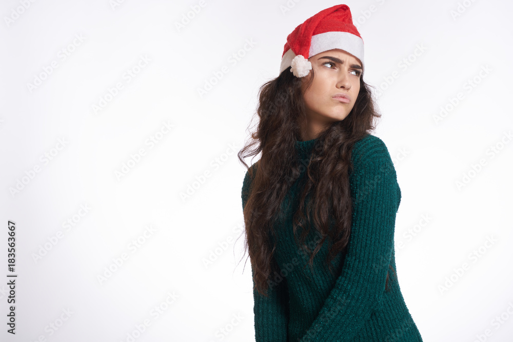 bright background, free space for copy, brunette woman frowns, new year, winter, holiday bright background, free space for copy, brunette woman frowns, new year, winter, holiday