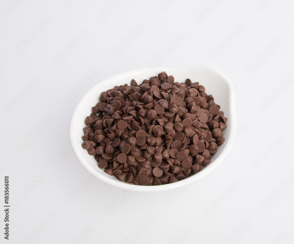 Chocolate chip morsels spread on a background. Chocolate chip morsels spread on a background.