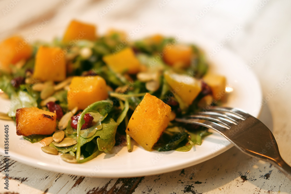 salad with pumpkin, pumpkin seeds and arugula salad with pumpkin, pumpkin seeds and arugula