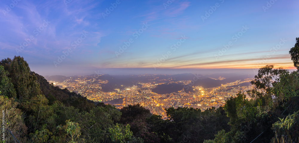 Aerial view of the central part of Caracas city, at sunset, from a lookout in Avila mountain, in Venezuela