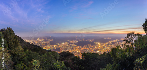 Aerial view of the central part of Caracas city, at sunset, from a lookout in Avila mountain, in Venezuela