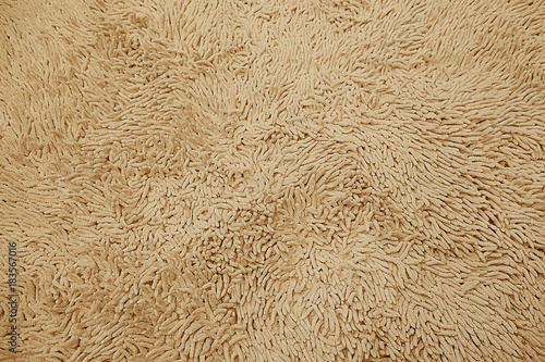 Brown woolen carpet texture background