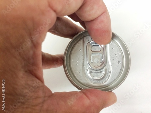 Close up a hand opening cover Aluminum canned drink