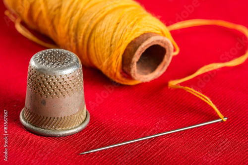 Needle with thread and thimble