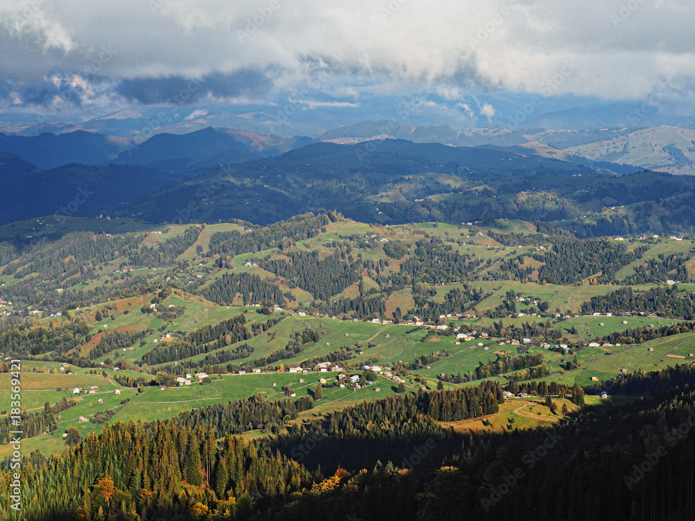 Carpatian mountains village at green forest