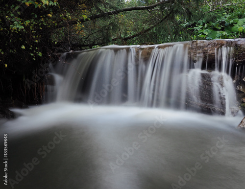 Waterfall at the carpatian mountains green forest © Sergii Mironenko