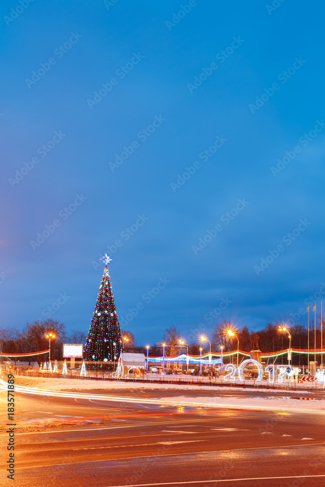 Christmas tree on a background of a blue evening sky