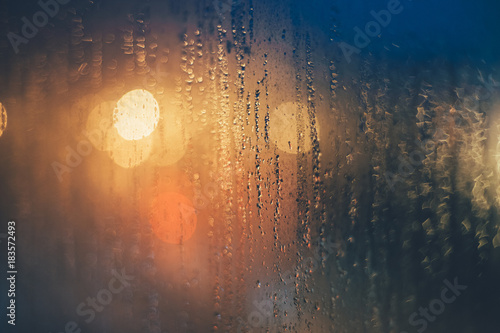Rain drops on the window against bokeh lights