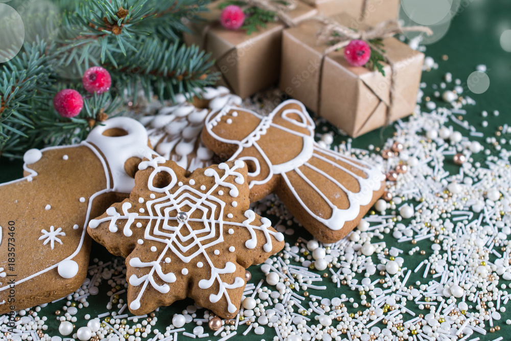 Christmas and holiday baking . Ginger cookies with decor on green background. Christmas and holiday baking . Ginger cookies with decor on green background.