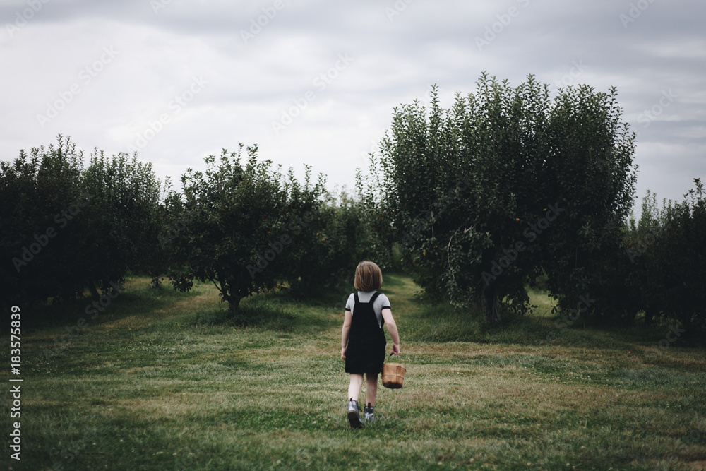 Little girl playing in a farm