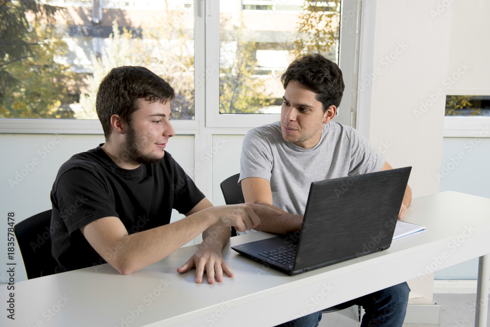 teenager university students working on school classroom with la teenager university students working on school classroom with la