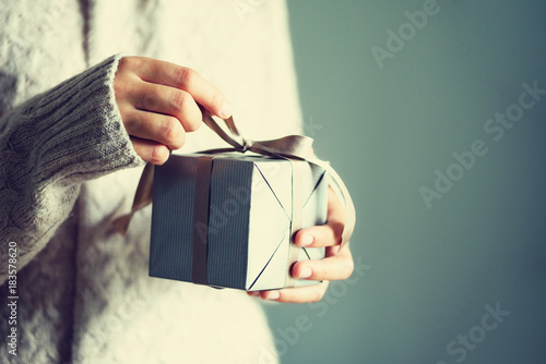 Female hands opening gift box, copy space. Christmas, hew year, birthday concept