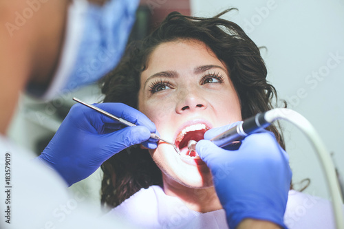 Young woman at dentist . Close up.