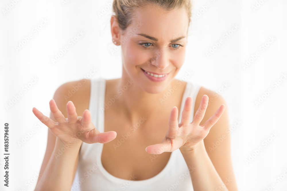 woman drying nail at home. french manicure woman drying nail at home. french manicure