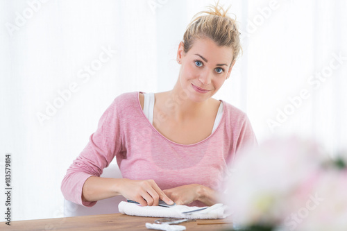 woman doing french manucure at home