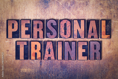 Personal Trainer Theme Letterpress Word on Wood Background