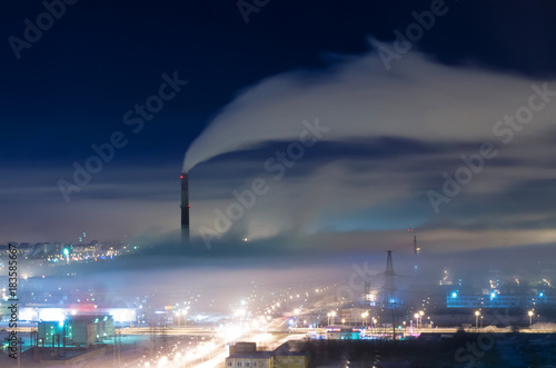 Plakat Industrial district of the city, pipes and smoke, with fog and smog at night.