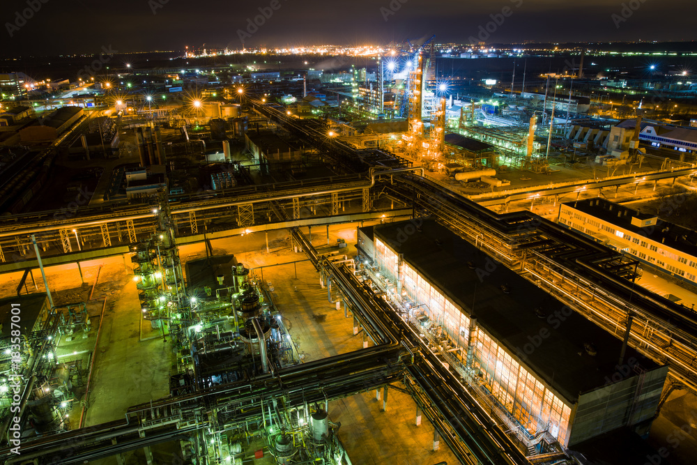 large chemical plant at night with light aerial view