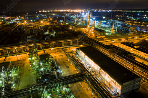 large chemical plant at night with light aerial view