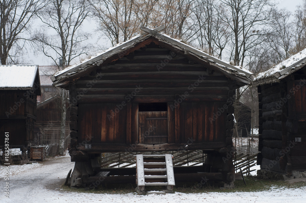 Old wooden farm houses in winter
