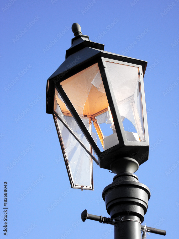 custom made wallpaper toronto digitalStreetlight burning during the day as a symbol of waste, losses and vandalism. Broken hooligans street lamp.