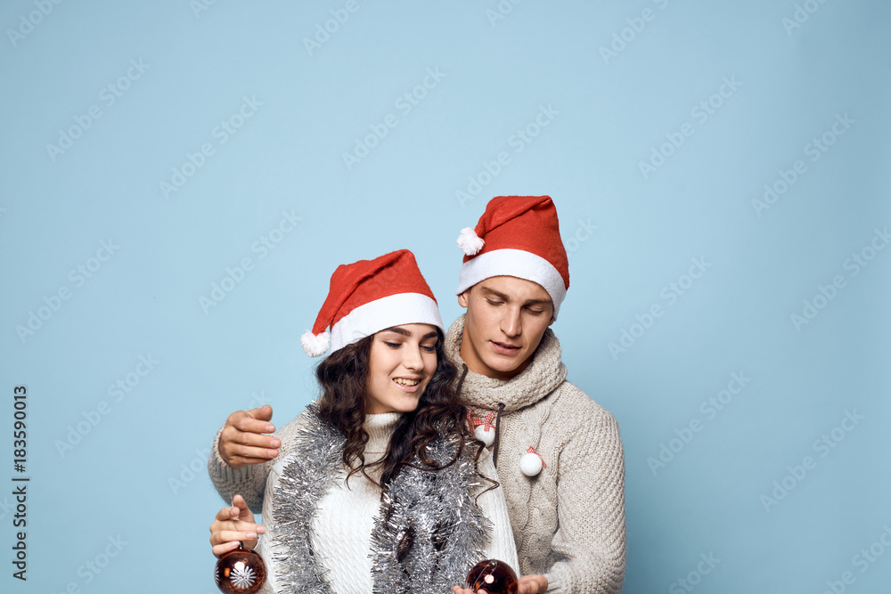 light blue background, free space for copy, couple, Christmas decorations, holiday light blue background, free space for copy, couple, Christmas decorations, holiday