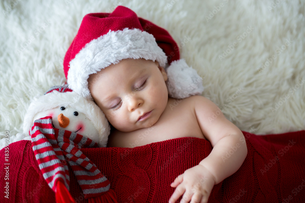 Little sleeping newborn baby boy, wearing Santa hat Little sleeping newborn baby boy, wearing Santa hat