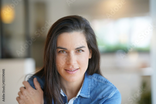 Portrait of middle-aged woman looking at camera Free Download Portrait of middle-aged woman looking at camera - GFXLoad