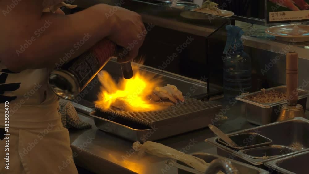 SEOUL, SOUTH KOREA – JULY 216 : Video shot of chef preparing food in local restaurant at night SEOUL, SOUTH KOREA – JULY 216 : Video shot of chef preparing food in local restaurant at night
