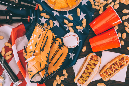 Canvas Print top view of hot dogs, plastic cups, peanuts, beer bottles, baseball ball and glo