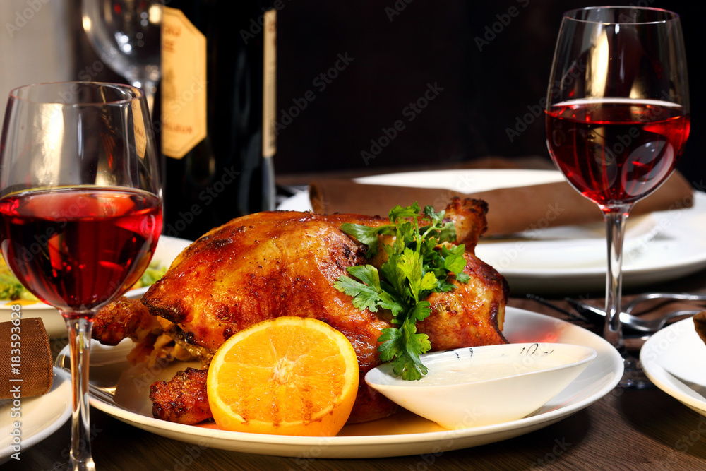 Naklejka premium luxury dinner served on the table with glasses of red wine