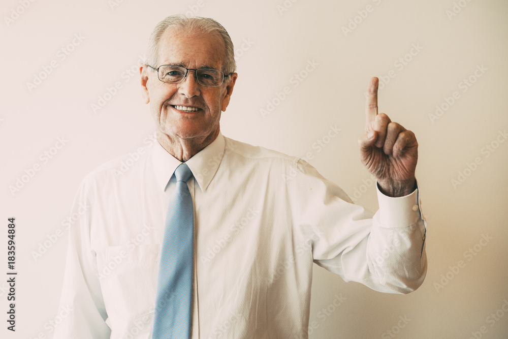 Portrait of smiling senior businessman having idea Portrait of smiling senior businessman having idea