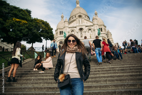 Beautiful girl is walkin in paris near the basilica © Aleksandr