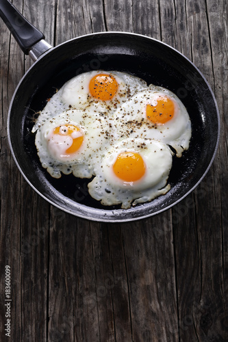 delicious fresh fried eggs in skillet