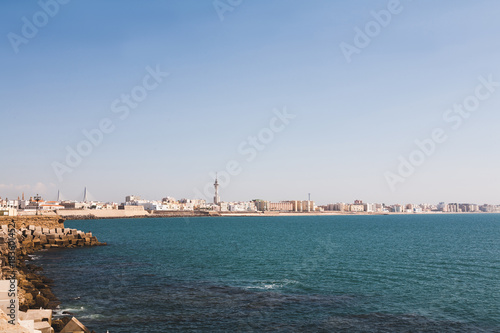 panoramic view of spanish city coastline under blue sky