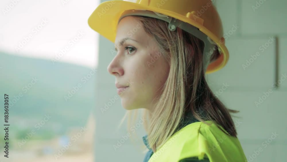 Young woman worker on the construction site. Young woman worker on the construction site.