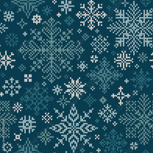 Seamless knitted pattern with white and turquoise snowflakes