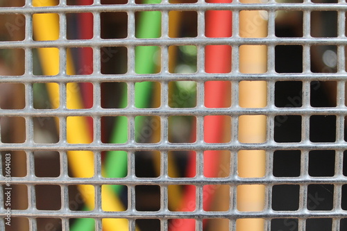 Steel grey nets with blurry wire on background for web site or mobile devices